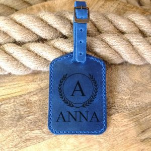 Personalized custom luggage tag handmade from blue leather with engraving name, initials, monogram, logo, phone number