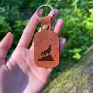 Keychain with wolf and personalized engraving of name, initials, memorable date, significant phrase handmade from high quality genuine leather